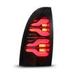 Load image into Gallery viewer, AlphaRex 05-15 Toyota Tacoma LUXX LED Taillights Blk/Red w/Activ Light/Seq Signal - Side View