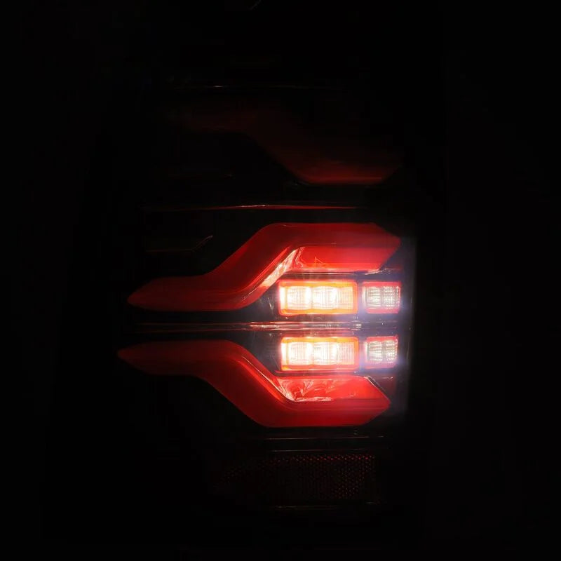 AlphaRex 05-15 Toyota Tacoma LUXX LED Taillights Blk/Red w/Activ Light/Seq Signal - Installation View