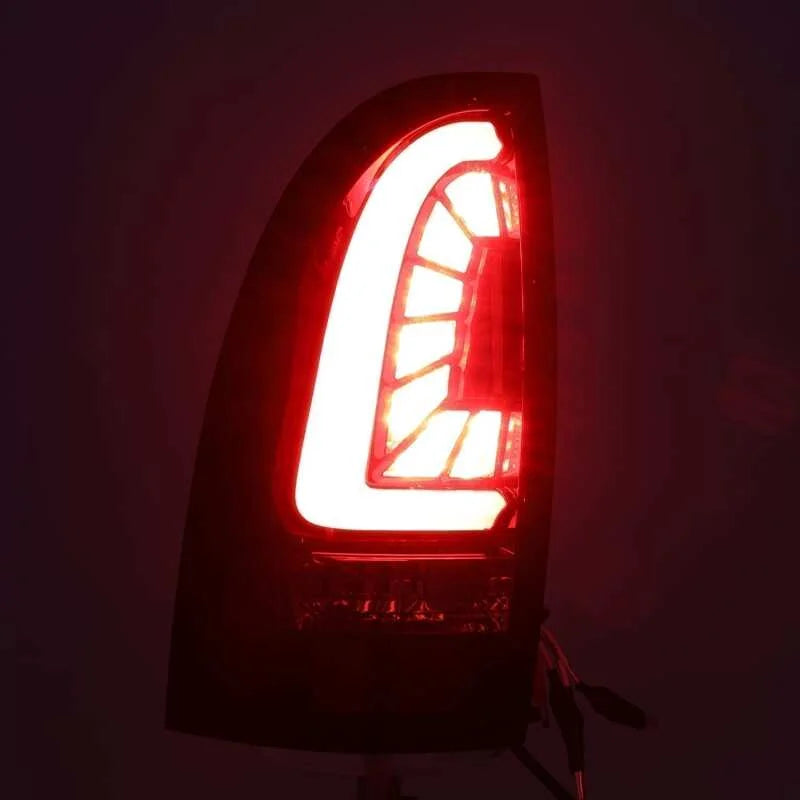 AlphaRex 05-15 Toyota Tacoma PRO-Series LED Tail Lights Red Smoke - Side View