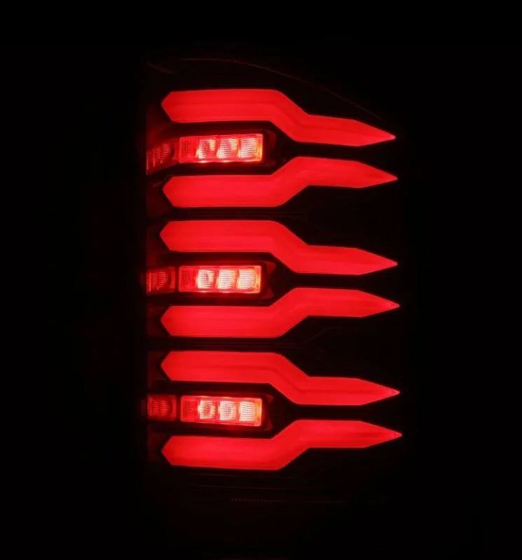 AlphaRex 07-14 Chevrolet Silverado 1500/2500HD/3500HD Luxx-Series LED Tail Lights Black/Red - Installation View