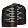 Load image into Gallery viewer, AlphaRex 07-14 Chevrolet Silverado 1500/2500HD/3500HD Luxx-Series LED Tail Lights Blk w/Smoked Lens - Main Product View