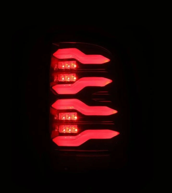 AlphaRex 09-18 Dodge RAM LUXX-Series LED Taillights Black Red w/Actv Light & SS - Side View