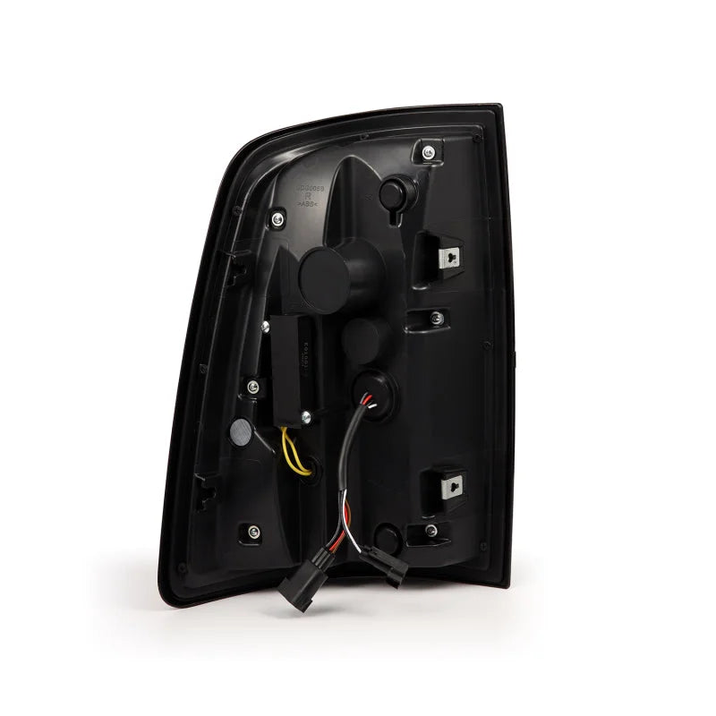 AlphaRex 09-18 Dodge Ram Luxx-Series LED Tail Lights Alpha-Black w/ Activation Light & Seq. Signal - Side View