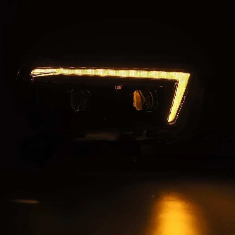 AlphaRex 10-13 Toyota 4Runner LUXX LED Proj Headlights Plank Style Alpha Black w/Seq Signal/DRL - Installation View