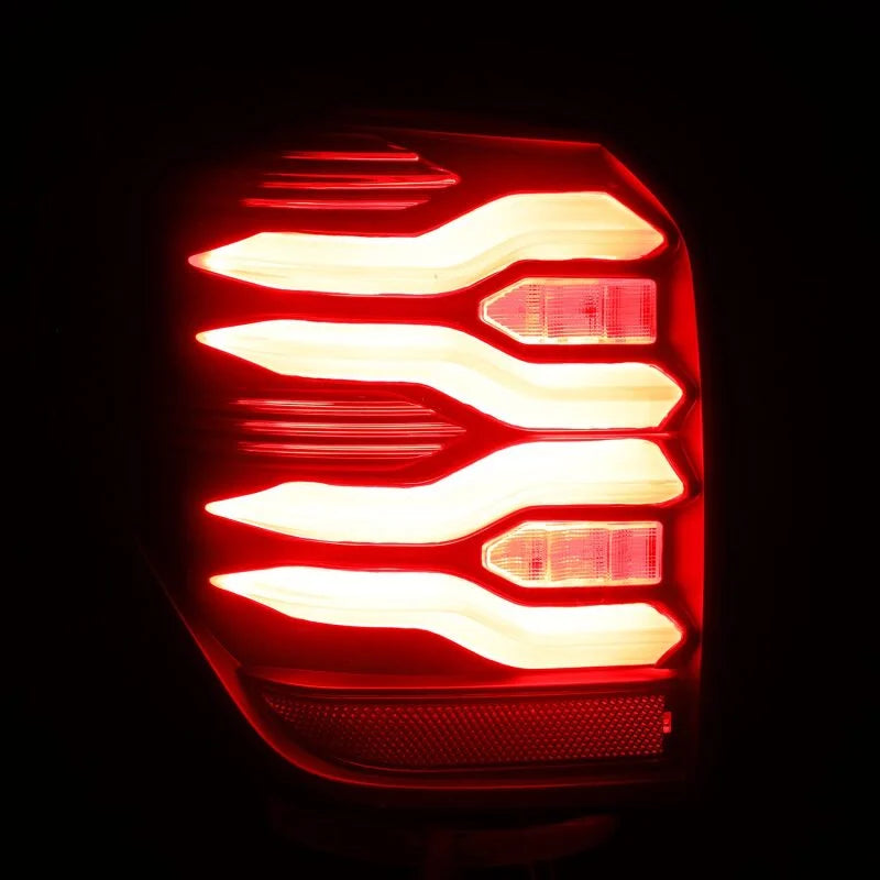 AlphaRex 10-21 Toyota 4Runner LUXX LED Taillights Blk/Red w/Activ Light/Seq Signal - Side View