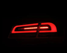Load image into Gallery viewer, AlphaRex 12-21 Tesla Model S LUXX-Series LED Tail Lights - Alpha-Black - Installation View