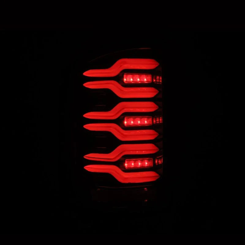 AlphaRex 14-18 GMC Sierra 1500/2500HD/3500HD LUXX-Series LED Tail Lights Alpha-Blk Actv Lgt Seq. Sig - Back View
