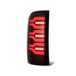 Load image into Gallery viewer, AlphaRex 14-18 GMC Sierra 1500/2500HD/3500HD LUXX-Series LED Tail Lights Blk w/Actv Light &amp; Seq. Sig - Back View
