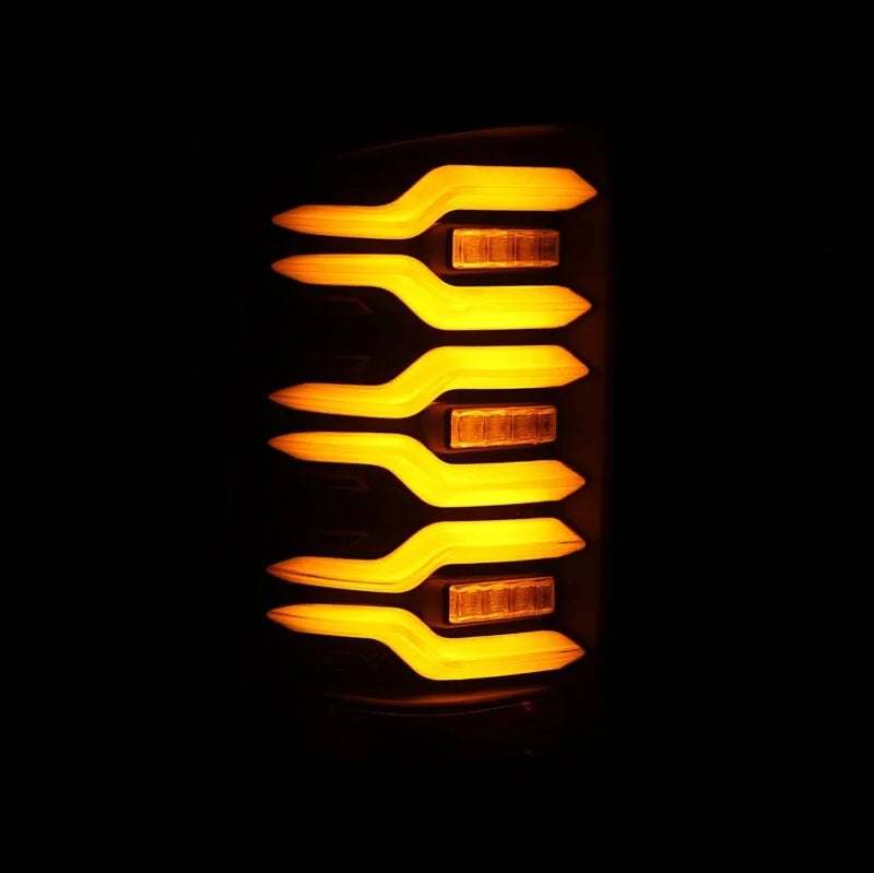 AlphaRex 14-18 GMC Sierra 1500/2500HD/3500HD LUXX-Series LED Tail Lights Blk w/Actv Light & Seq. Sig - Installation View