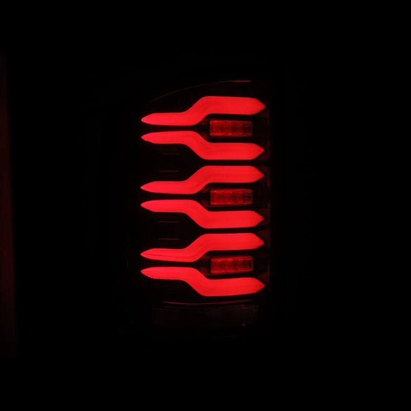 AlphaRex 14-18 GMC Sierra 1500/2500HD/3500HD LUXX-Series LED Tail Lights Blk/Red w/Actv Lgt Seq. Sig - Installation View