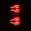 Load image into Gallery viewer, AlphaRex 14-21 Toyota Tundra LUXX LED Taillights Blk w/Activ Light/Seq Signal - Installation View