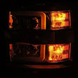Load image into Gallery viewer, AlphaRex 15-19 Chevy Silverado 2500/3500 LUXX-Series Proj. Headlights Blk w/Actv SeqSig &amp; SBDRL - Side View