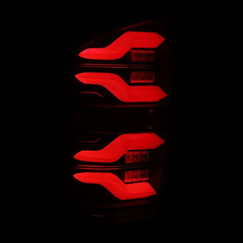 AlphaRex 16-21 Toyota Tacoma LUXX LED Taillights Alpha Blk w/Activ Light/Seq Signal - Back View