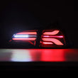 Load image into Gallery viewer, AlphaRex 17-22 Tesla Model 3 PRO-Series LED Tail Lights Jet Black w/Seq Sig - Installation View