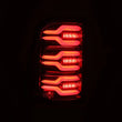 Load image into Gallery viewer, AlphaRex 19-21 Dodge Ram 1500 Luxx-Series LED Tail Lights Alpha-Black w/Activ Light/Seq Signal - Installation View