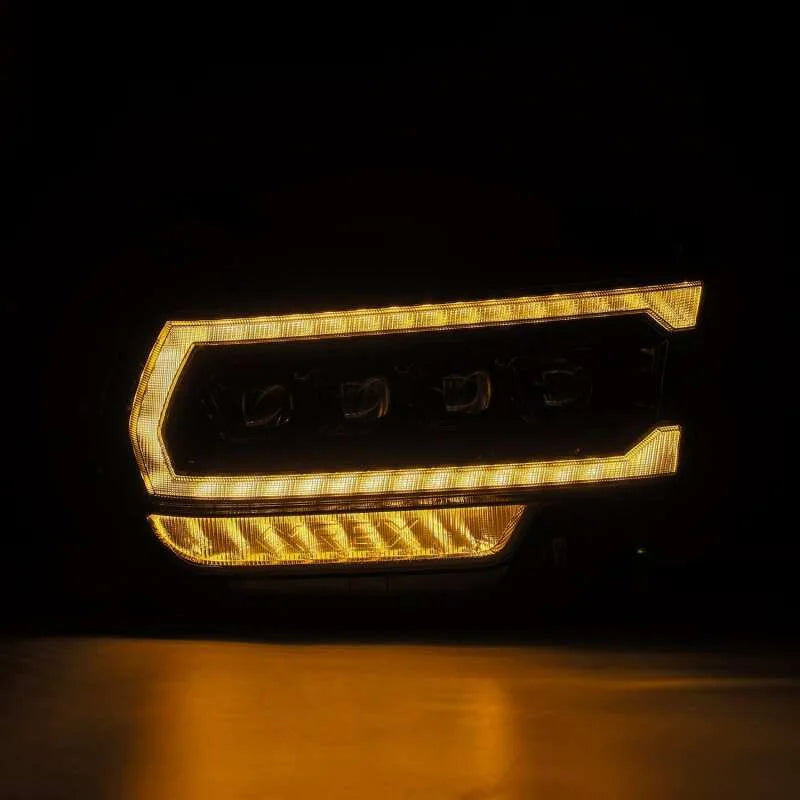 AlphaRex 19-21 Ram 2500 NOVA LED Proj Headlights Plank Style Alpha Blk w/Activ Light/Seq Signal/DRL - Side View