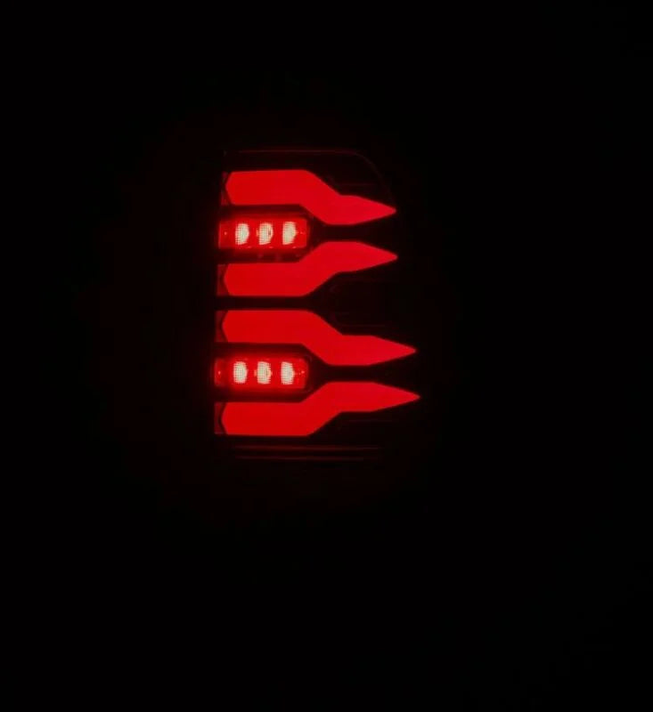 AlphaRex 97-03 Ford F150 / 99-16 Ford F250/F350/F450/F550 LUXX-Series LED Tail Lights - Black/Red - Side View