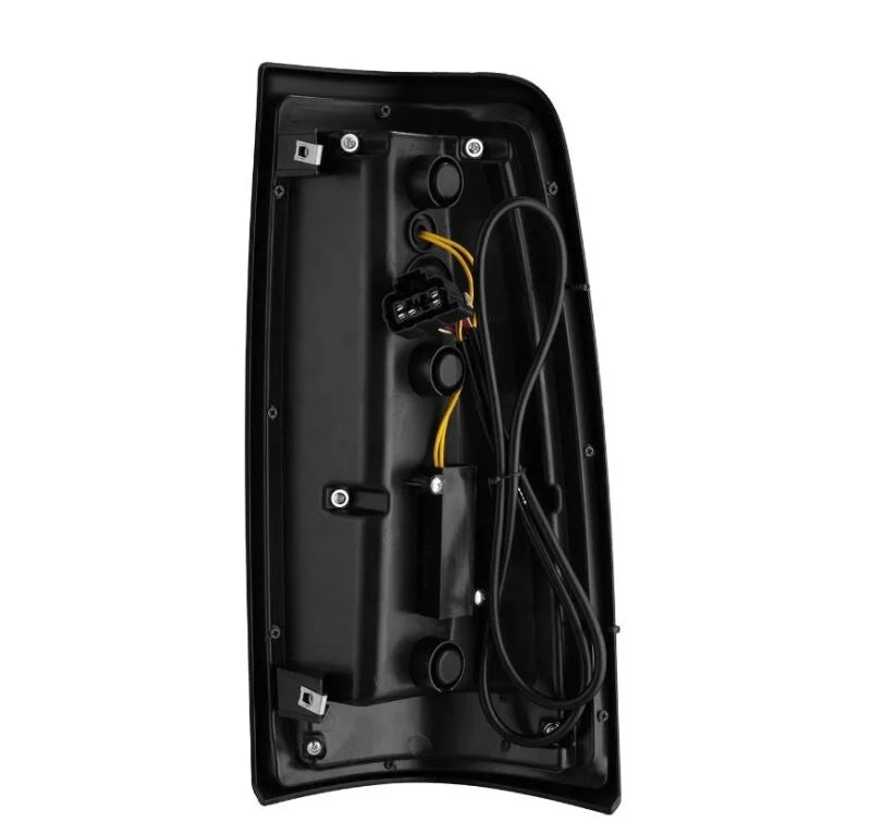 AlphaRex 99-06 Chevrolet Silverado/99-06 GMC Sierra LUXX-Series LED Tail Lights - Black/Red - Installation View