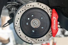 Load image into Gallery viewer, BMR 14-19 Chevrolet Corvette Brake Kit For 15in Conversion Drilled And Slotted Rotors/Red Calipers - Side View