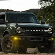 Load image into Gallery viewer, Baja Designs 21-22 Ford Bronco w/Steel Bumper S2 SAE Sportsmen Fog Pocket Light Kit - Amber - Side View