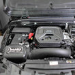 Load image into Gallery viewer, Banks Power 18-21 Jeep 2.0L Turbo Wrangler (JL) Dry Filter Ram-Air Intake System - Installation View