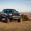 Load image into Gallery viewer, Body Armor 4x4 12-15 Toyota Tacoma HiLine Front Winch Bumper - Installation View