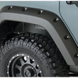 Load image into Gallery viewer, Bushwacker 07-18 Jeep Wrangler Unlimited Pocket Style Flares 2pc 4-Door Sport Utility Only - Black - Side View