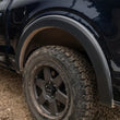 Load image into Gallery viewer, Bushwacker 09-14 Ford F-150 Styleside OE Style Flares 4pc 67.0/78.8/97.4in Bed - Black - Back View