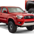 Load image into Gallery viewer, Bushwacker 12-15 Toyota Tacoma Fleetside Pocket Style Flares 4pc 73.5in Bed - Black - Main Product View