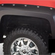 Load image into Gallery viewer, Bushwacker 16-18 Chevy Silverado 1500 Fleetside Pocket Style Flares 4pc 69.3in Bed - Black - Back View