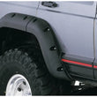 Load image into Gallery viewer, Bushwacker 84-01 Jeep Cherokee Cutout Style Flares 4pc Fits 4-Door Sport Utility Only - Black - Back View
