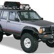 Load image into Gallery viewer, Bushwacker 84-01 Jeep Cherokee Cutout Style Flares 4pc Fits 4-Door Sport Utility Only - Black - Additional View 5