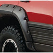 Load image into Gallery viewer, Bushwacker 93-98 Jeep Grand Cherokee Cutout Style Flares 4pc - Black - Back View