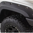 Load image into Gallery viewer, Bushwacker 99-04 Jeep Grand Cherokee Cutout Style Flares 2pc - Black - Side View
