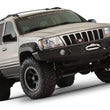 Load image into Gallery viewer, Bushwacker 99-04 Jeep Grand Cherokee Cutout Style Flares 4pc - Black - Installation View