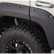 Load image into Gallery viewer, Bushwacker 99-04 Jeep Grand Cherokee Cutout Style Flares 4pc - Black - Additional View 6