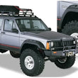 Load image into Gallery viewer, Bushwacker 84-01 Jeep Cherokee Cutout Style Flares 4pc Fits 4-Door Sport Utility Only - Black - Main Product View