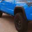 Load image into Gallery viewer, Cali Raised 05-23 Toyota Tacoma Trail Ed Rock Sliders - Double Cab Long Bed/Kick Out/PwdrCoat