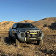 Load image into Gallery viewer, Camburg 22-25 Toyota Tundra 2WD/4WD Blue KINETIK Uniball Trail Series Long Travel Kit w/ Billet UCA - Back View