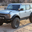 Load image into Gallery viewer, Camburg Ford Bronco 21-23 KINETIK V2 Performance Billet Uniball Upper Arms (Red) - Back View