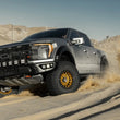 Load image into Gallery viewer, Camburg Ford Raptor 21-23 1.5in Front Spring Preload Spacer Kit (Fox Orange) - Installation View
