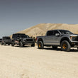 Load image into Gallery viewer, Camburg Ford Raptor 21-23 1in Front Spring Preload Spacer Kit (Fox Orange) - Installation View