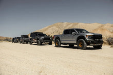 Load image into Gallery viewer, Camburg Ford Raptor 21-23 1in Front Spring Preload Spacer Kit (Fox Orange) - Installation View