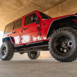 Load image into Gallery viewer, DV8 Offroad 07-18 Jeep Wrangler JK (4 Door Only) OE Plus Side Steps - Side View