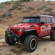 Load image into Gallery viewer, DV8 Offroad 07-18 Jeep Wrangler JK Metal Heat Dispersion Hood - Primer Black - Back View