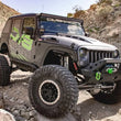 Load image into Gallery viewer, DV8 Offroad 07-18 Jeep Wrangler JK Metal Heat Dispersion Hood - Primer Black - Additional View 10