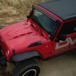Load image into Gallery viewer, DV8 Offroad 07-18 Jeep Wrangler JK Metal Heat Dispersion Hood - Primer Black - Additional View 11