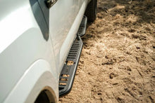 Load image into Gallery viewer, DV8 Offroad 16-23 Toyota Tacoma Crew Cab OE Plus Side Steps - Back View