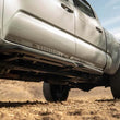 Load image into Gallery viewer, DV8 Offroad 16-23 Toyota Tacoma Crew Cab OE Plus Side Steps - Additional View 6