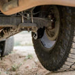 Load image into Gallery viewer, DV8 Offroad 16-23 Toyota Tacoma Rear Shock Skid Plates - Additional View 7